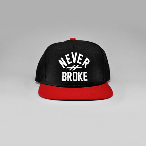 NEVER BROKE SNAPBACK HAT (BLACK)